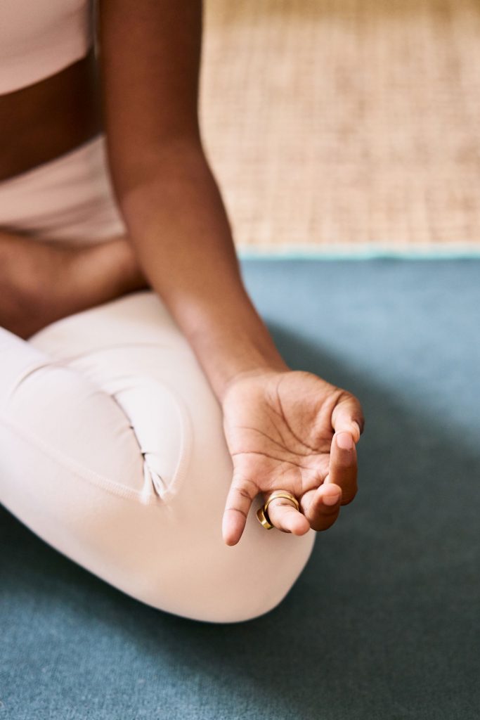 Woman seated in yoga position