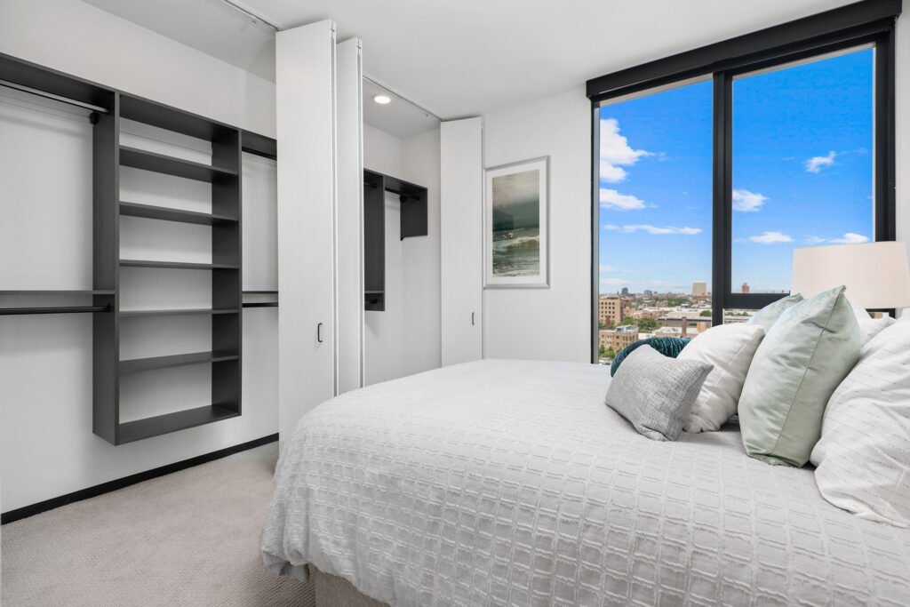 Parq Fulton apartment bedroom with built-in shelves in the closets