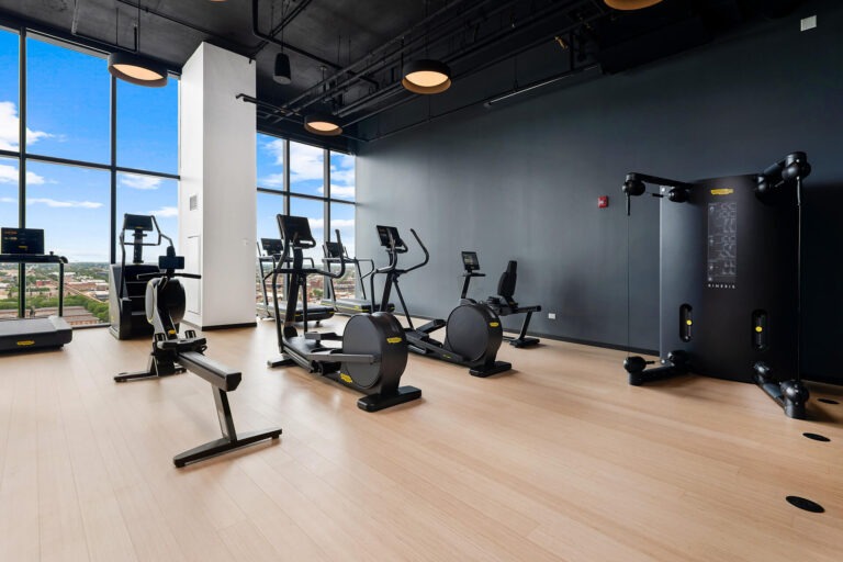Fully equipped apartment gym with strength and cardio machines