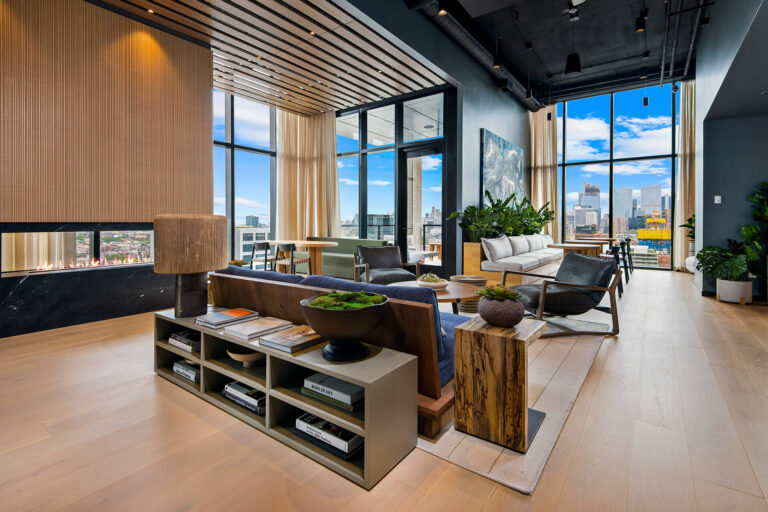 Modern resident lounge with comfortable seating and city views